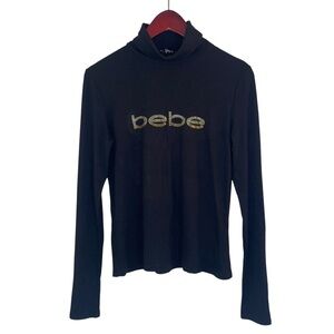 Bebe rhinestone turtleneck long sleeve top black gold women’s large NWT